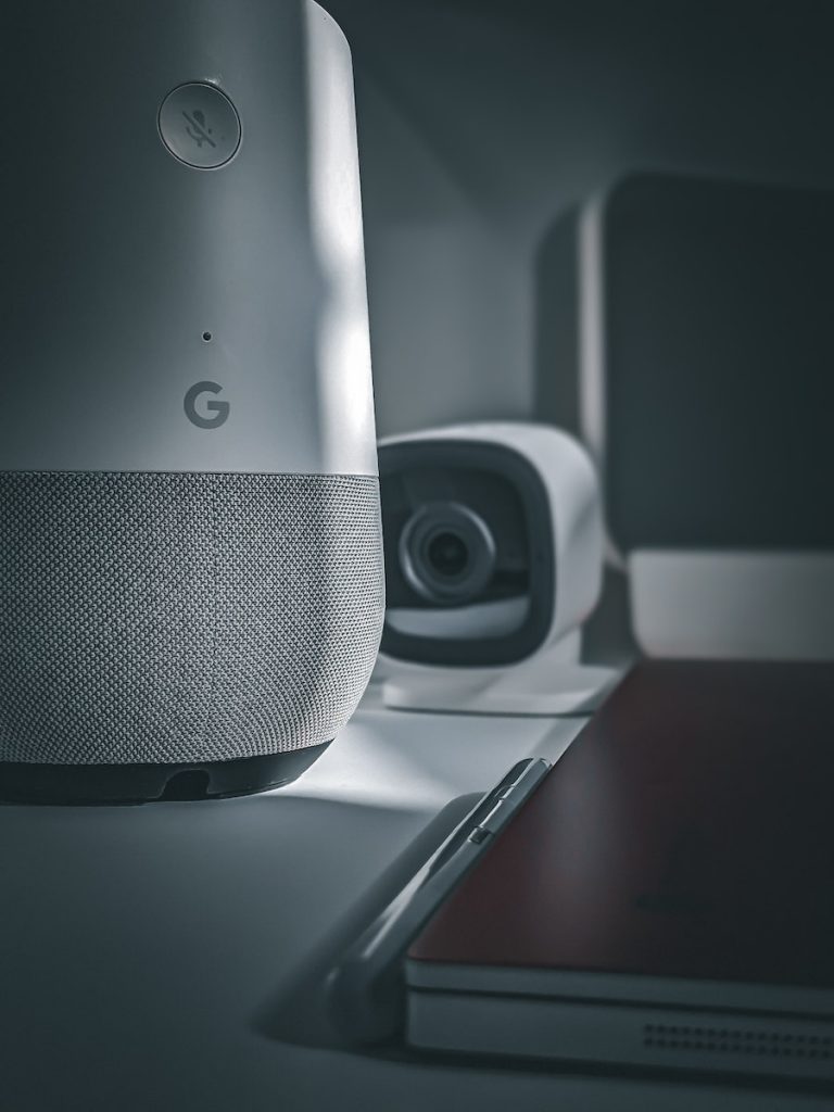 Silver and Black Speaker on White Table