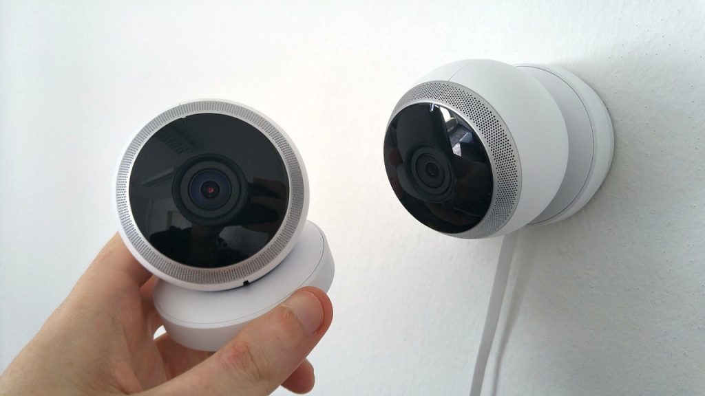 two cameras with white body