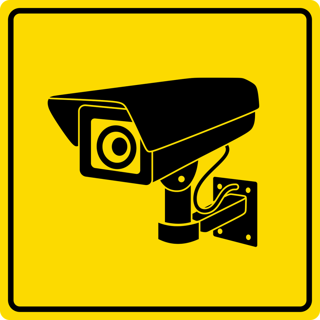 image of cctv on yellow background