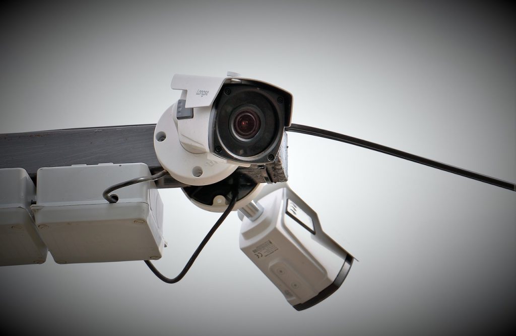 security camera with white body mounted