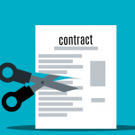 photo of contract and scissors on blue background