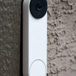 smart doorbell with white body and black camera